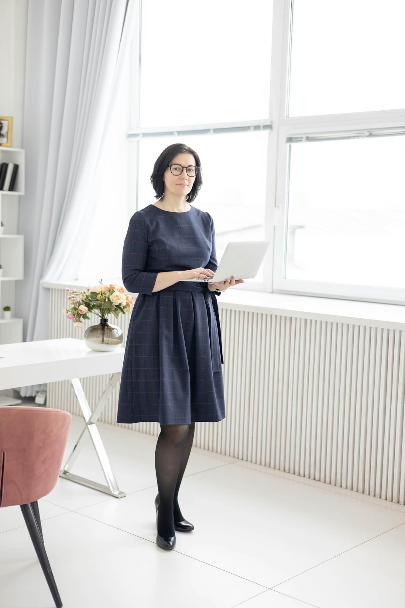 a-young-woman-in-glasses-and-in-a-blue-shirt-works-at-home-at-a-laptop-as-a-coach.jpg