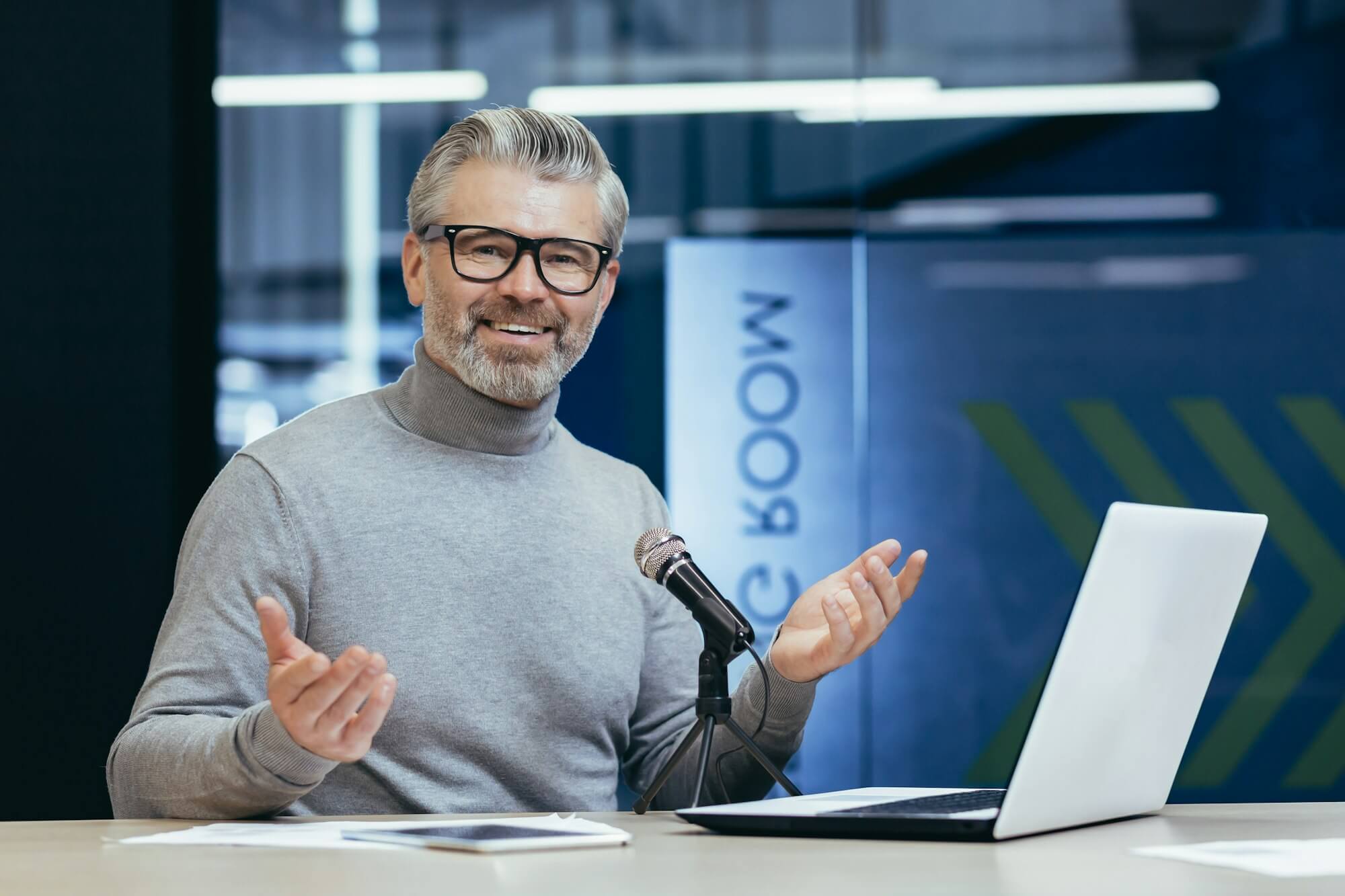 successful-mature-financier-business-coach-teacher-working-inside-office-with-laptop-and.jpg