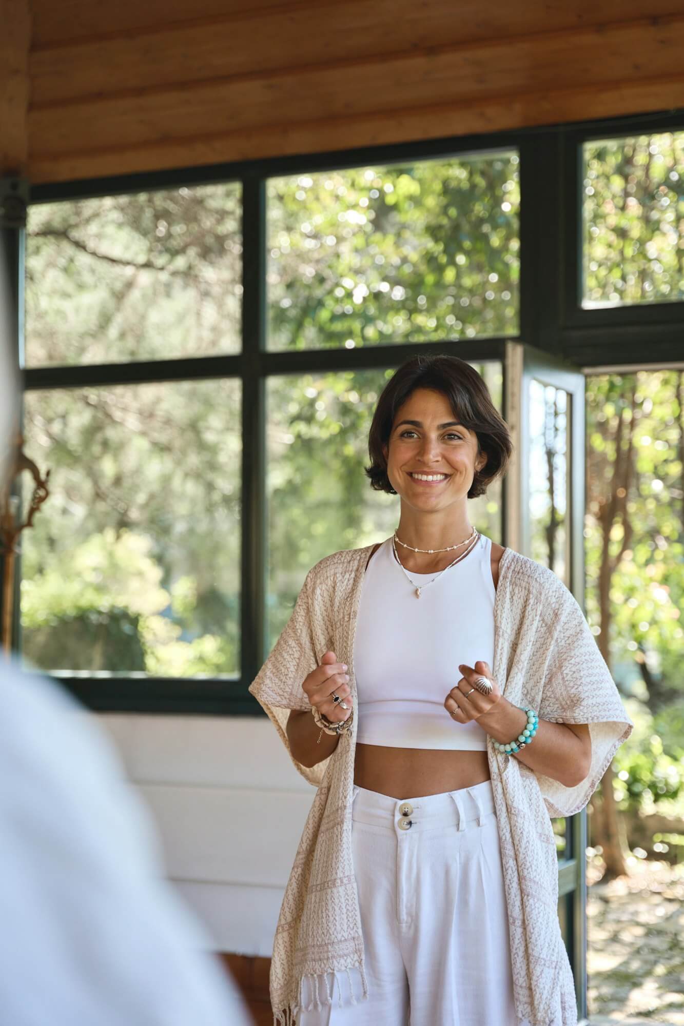 young-happy-woman-yoga-coach-training-people-group-talking-at-holistic-session-.jpg